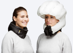 Photo montage of a model wearing the Hovding airbag bike helmet worn around the neck and fully inflated