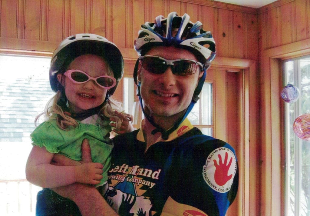 Celebrating cycling dads on father's day – Photo of Phil D. with daughter, ready for a ride in the Burley trailer