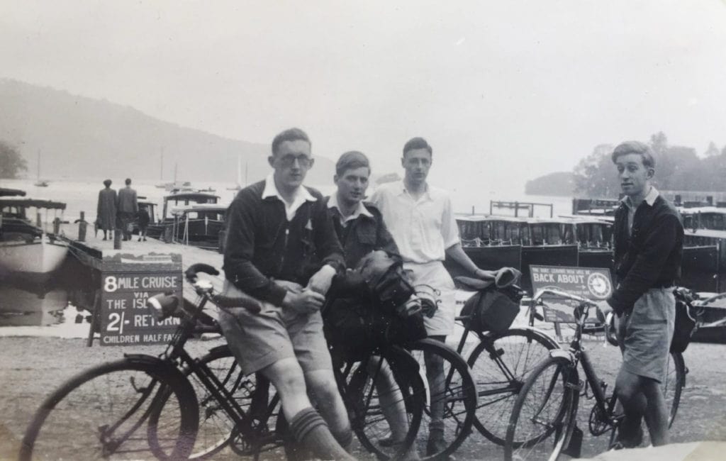 celebrating cycling dads for father's day – Mick Dodgson and friends on a cycling tour in England's Lake District 1940s, waiting for a boat ride.