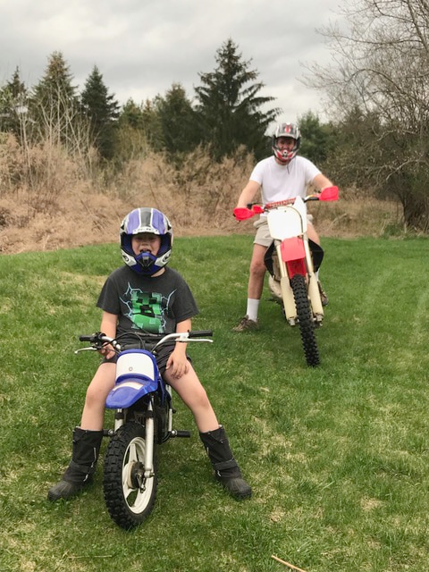 Celebrating cycling dads on father's day – Photo of Joel  with son enjoying powered 2-wheelers