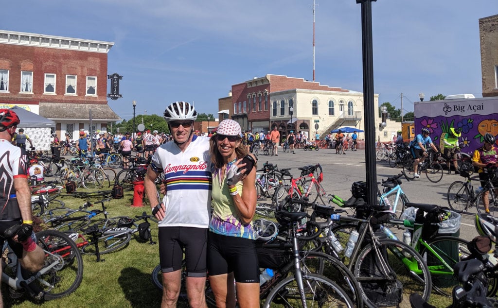 RAGBRAI 2019 - Jeanette S of Terry Bicycles and companion in a bicycle filled street in an Iowa town