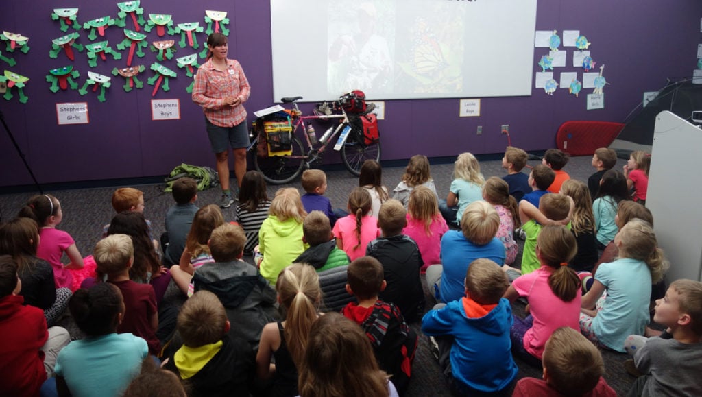 Sara giving a talk to elementary school students about her ride with the butterfly migration