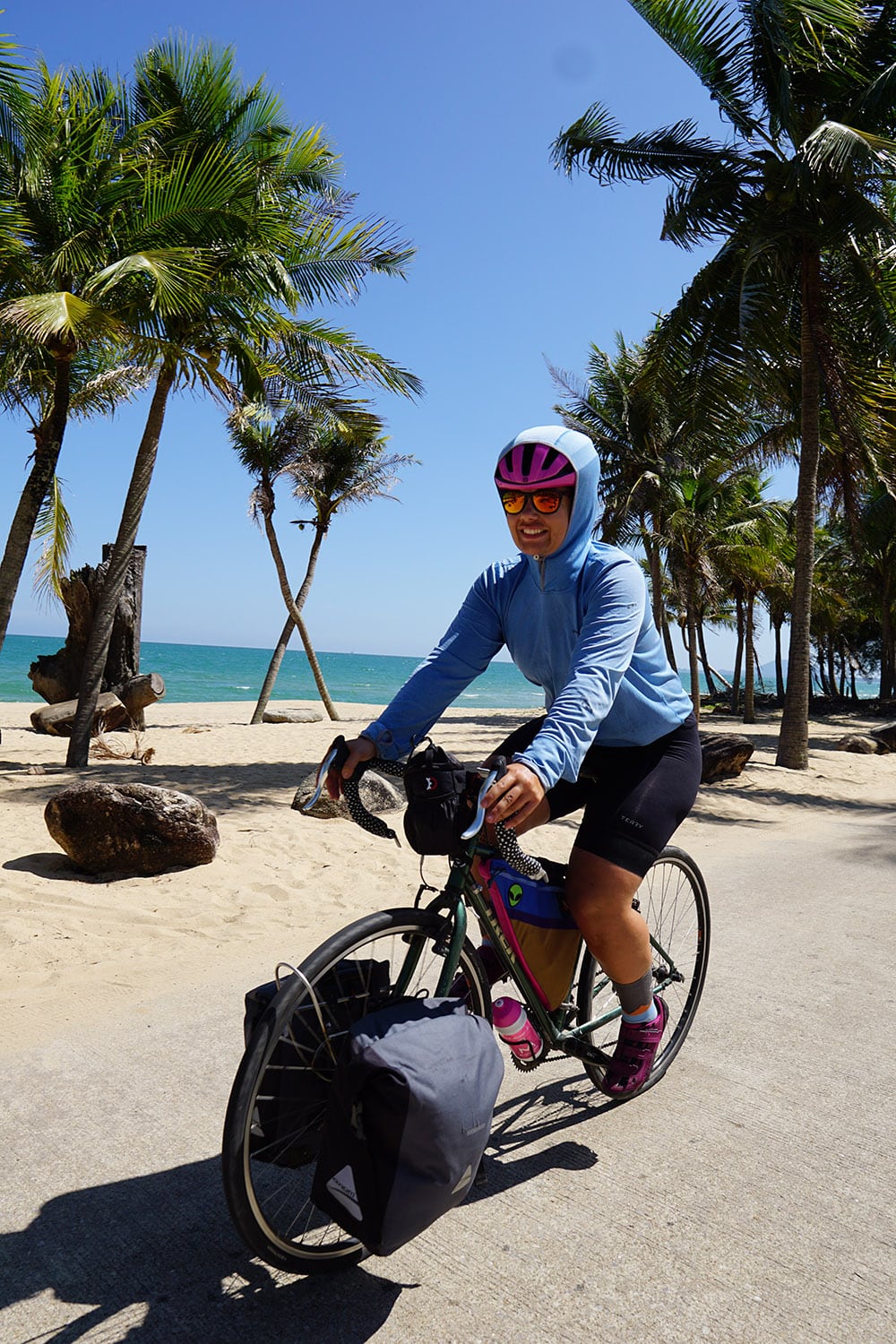 Cycling in the heat of the day, trying to keep the sun off - Ban Krood Beach, Thailand