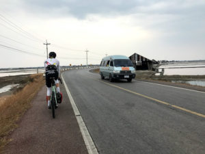 Cycling through salt flats on our cycling tour of Thailand