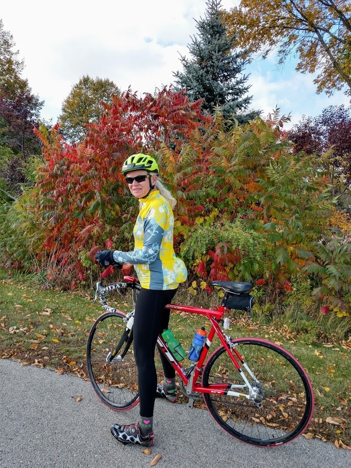 Tracy Flucke pauses during a fall 2020 bike ride