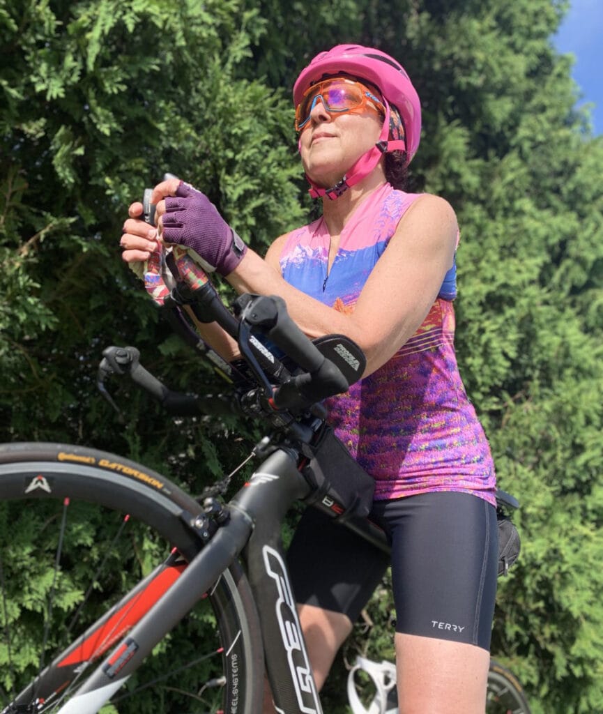Terry Amabassador, Kathy Hahn, with her triathlon bike, wearing Terry Chill Tri Shorts & Sun Goddess Jersey in Mont Ventoux